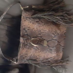 Gorgeous heavily fringed snake hobo bag w/dust bag. Never used. Magnetic clasp